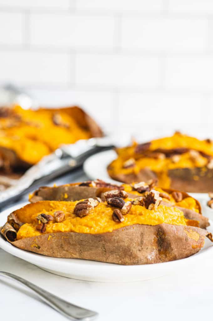 Twice Baked Sweet Potatoes - Creamy and rich made with maple syrup and cream cheese. Sweet and savory sweet potatoes are as decadent as the famous casserole, but easy enough for a weeknight dinner.