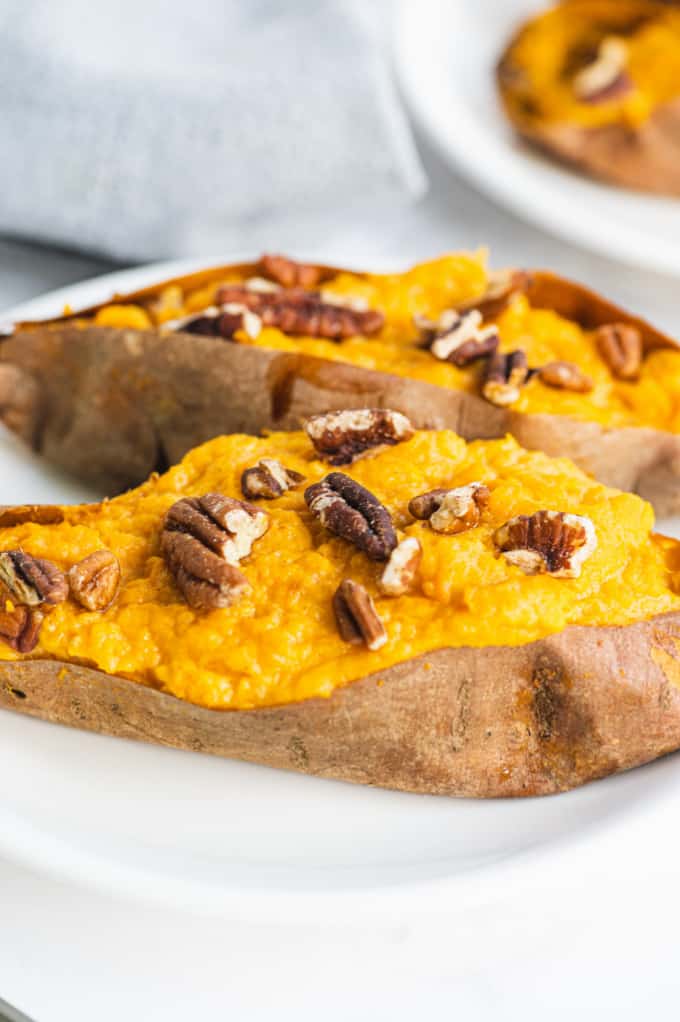 Twice Baked Sweet Potatoes - Creamy and rich made with maple syrup and cream cheese. Sweet and savory sweet potatoes are as decadent as the famous casserole, but easy enough for a weeknight dinner.