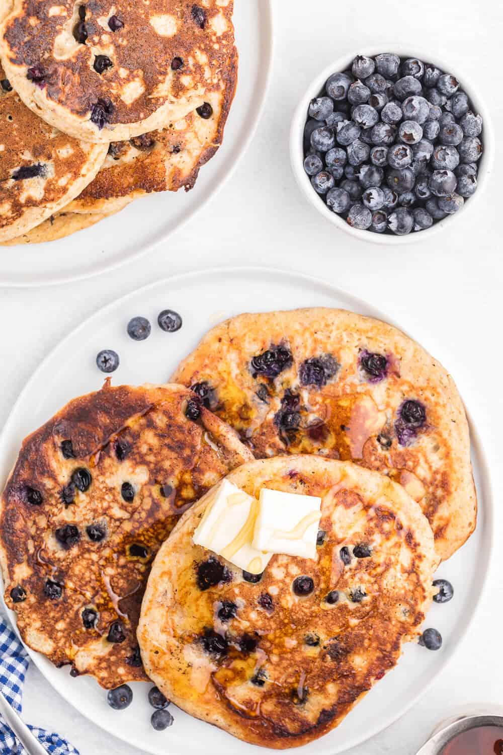 Whole Wheat Blueberry Pancakes - Blueberries are a wonder food, packed with fibre and antioxidants. Mixed into a light and fluffy whole wheat batter, these are a great way to add some extra nutrition without sacrificing delicious flavour.