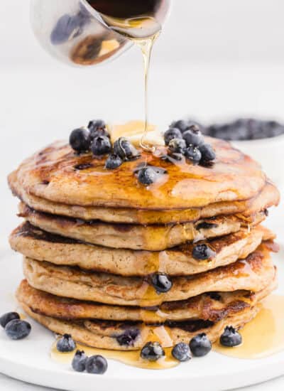 Whole Wheat Blueberry Pancakes - Blueberries are a wonder food, packed with fibre and antioxidants. Mixed into a light and fluffy whole wheat batter, these are a great way to add some extra nutrition without sacrificing delicious flavour.