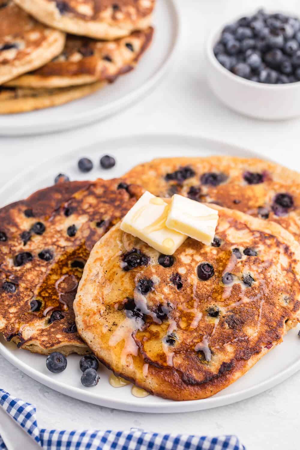 Whole Wheat Blueberry Pancakes - Blueberries are a wonder food, packed with fibre and antioxidants. Mixed into a light and fluffy whole wheat batter, these are a great way to add some extra nutrition without sacrificing delicious flavour.