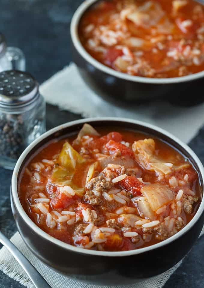 Cabbage Roll Soup - Hearty and comforting! This delicious and easy slow cooker soup recipe is loaded with tender cabbage, ground beef, oregano, garlic, and tomatoes. Everything you love about a cabbage roll, but 100 times easier to make. Yum!