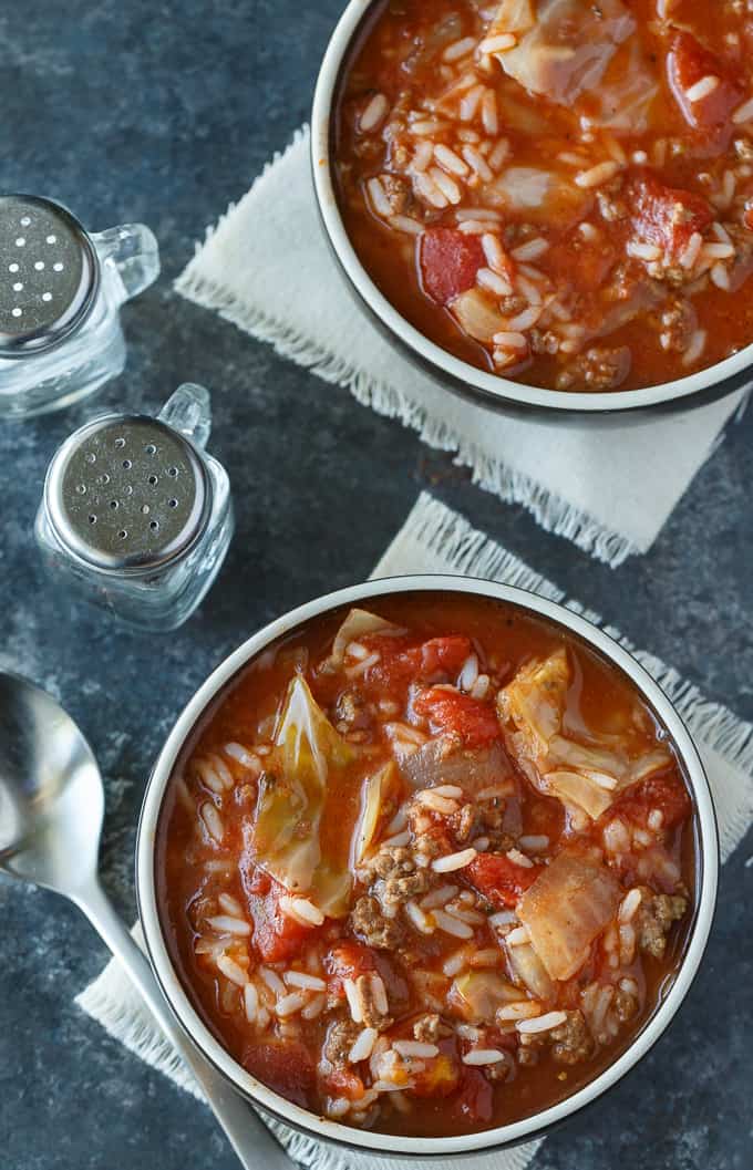 Cabbage Roll Soup - Hearty and comforting! This delicious and easy slow cooker soup recipe is loaded with tender cabbage, ground beef, oregano, garlic, and tomatoes. Everything you love about a cabbage roll, but 100 times easier to make. Yum!