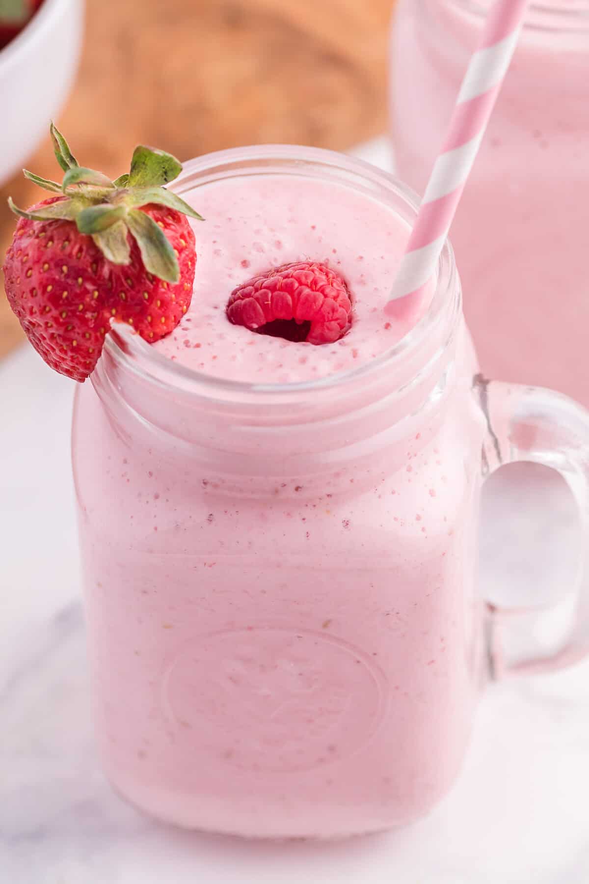 Photo of a glass of berry jam smoothie 