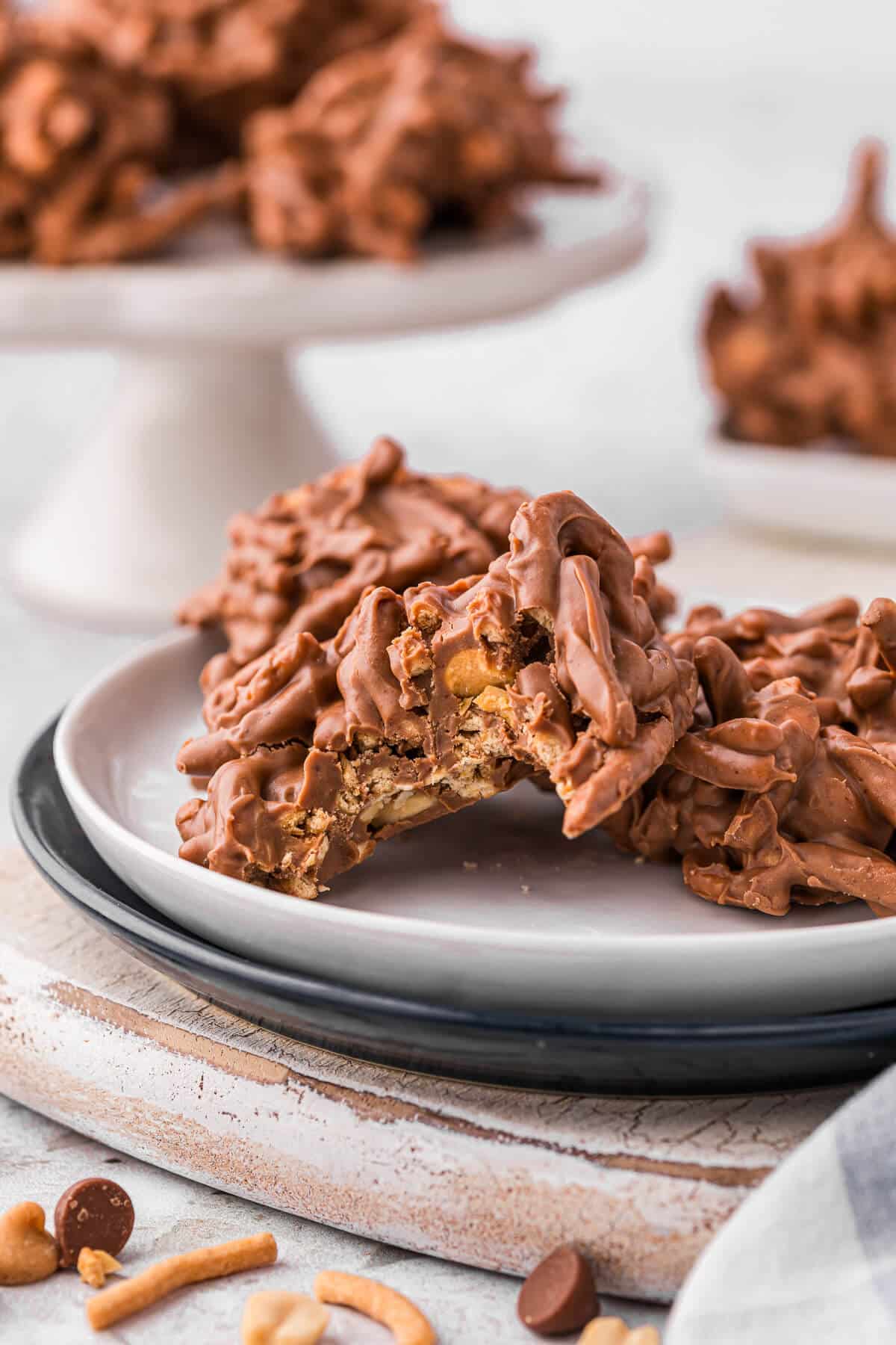 Haystacks on a plate with one with a bite out of it.