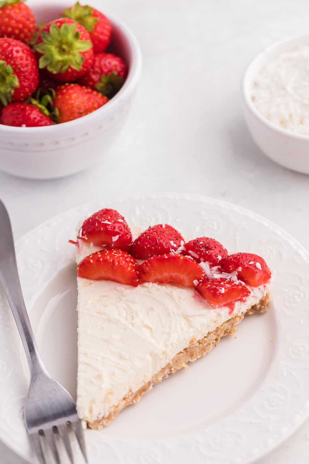 A slice of no-bake strawberry cheesecake