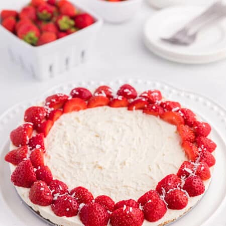 A whole no-bake strawberry cheesecake