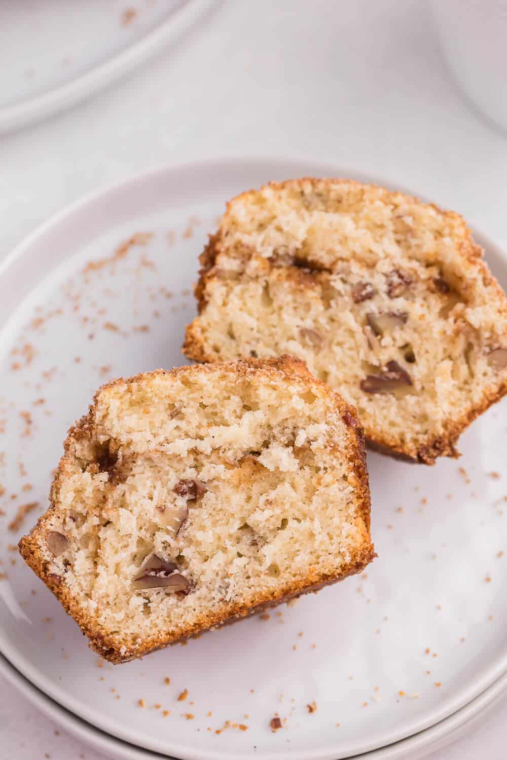 Sliced pecan coffee cake muffins a plate