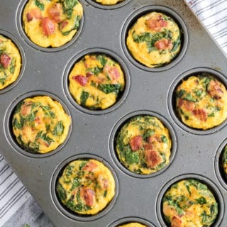 Spinach & Cheese Egg Muffins - a mini frittata made with bacon, onions, cheese and spinach. Always a breakfast fave!