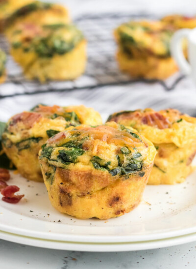 Spinach & Cheese Egg Muffins - a mini frittata made with bacon, onions, cheese and spinach. Always a breakfast fave!