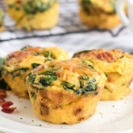 Spinach & Cheese Egg Muffins - a mini frittata made with bacon, onions, cheese and spinach. Always a breakfast fave!