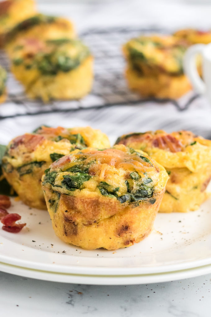 Spinach & Cheese Egg Muffins - a mini frittata made with bacon, onions, cheese and spinach. Always a breakfast fave!