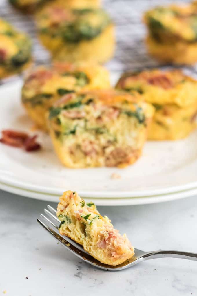 Spinach & Cheese Egg Muffins - a mini frittata made with bacon, onions, cheese and spinach. Always a breakfast fave!