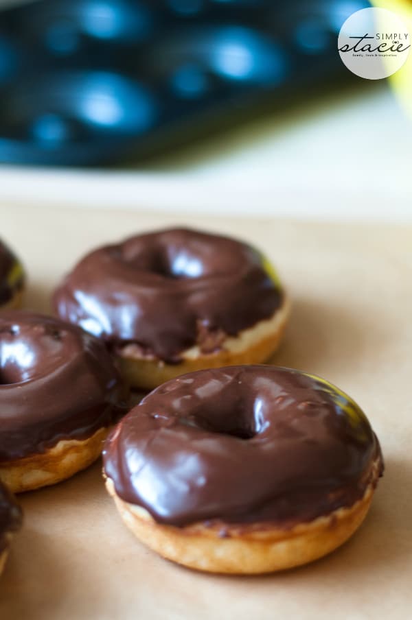 Cake Donuts with Chocolate Glaze - Skip the coffee shop and make some easy homemade cake donuts! These easy treats are baked, not fried, and are topped with a delicious chocolate glaze. 