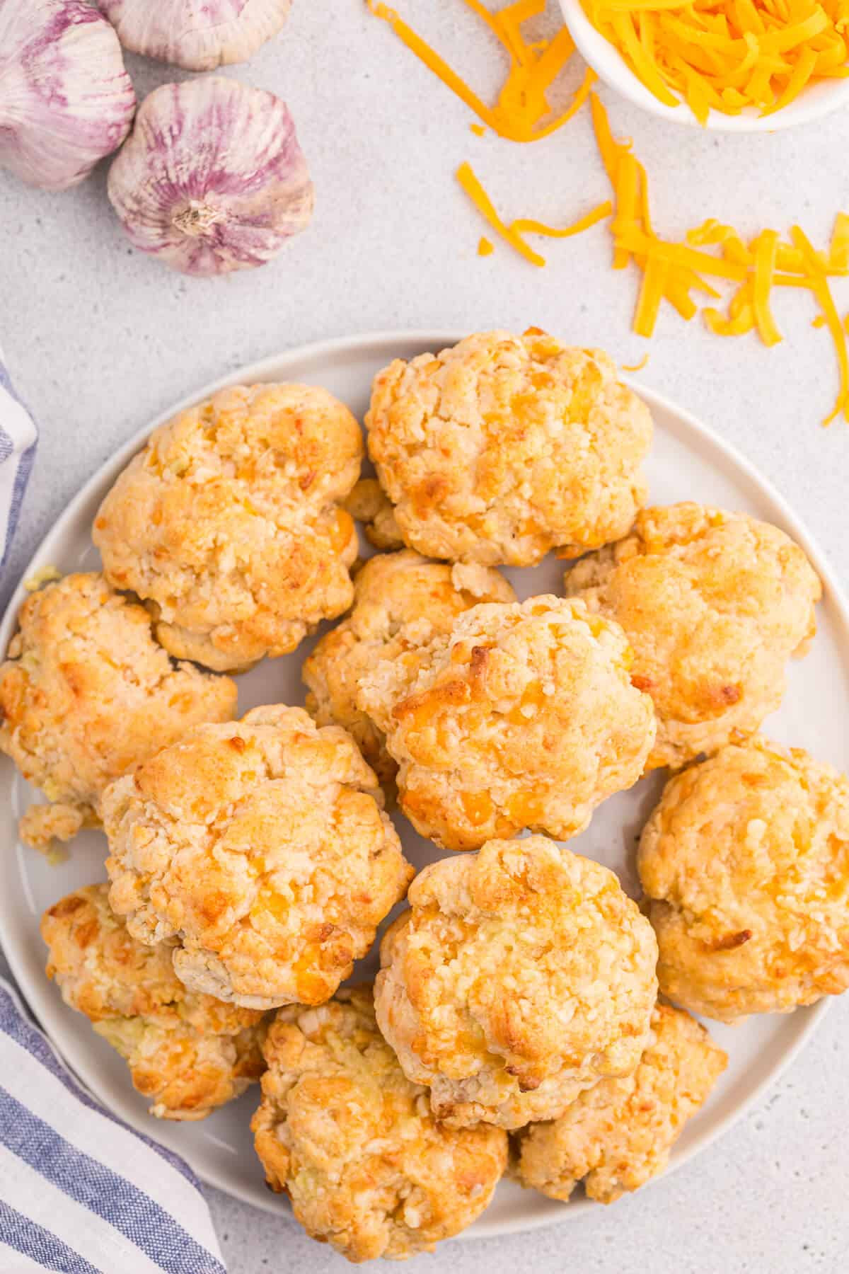 Cheesy garlic biscuits on a plate.