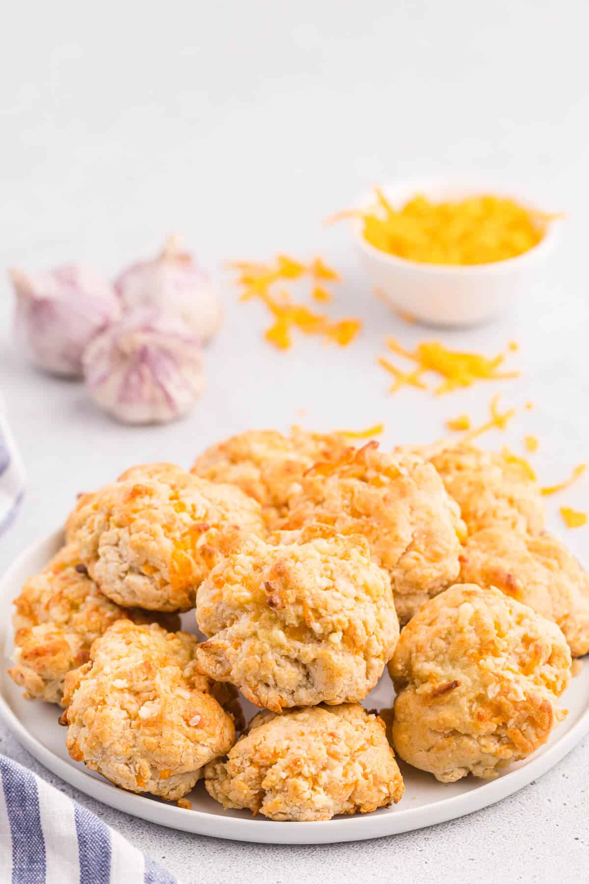 Cheesy garlic biscuits on a plate.