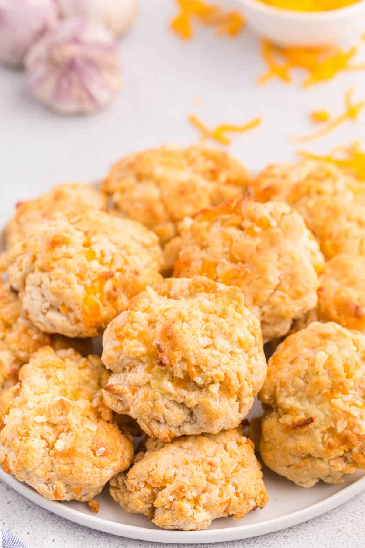 Cheesy garlic biscuits on a plate.