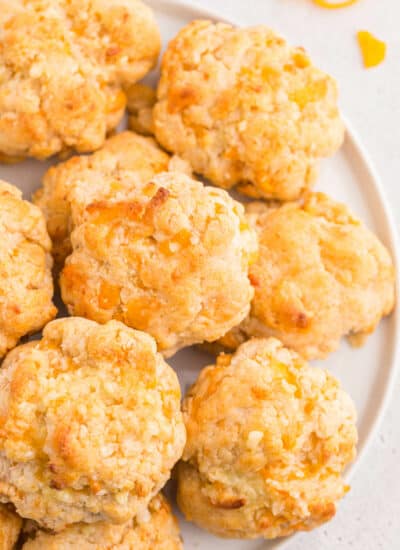 Cheesy garlic biscuits on a plate.