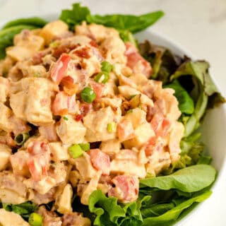 Chicken BLT Salad on a bed of lettuce.