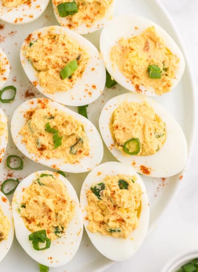 Salsa Deviled Eggs - a spicy kick to a popular appetizer recipe! This recipe is always gobbled up quickly.