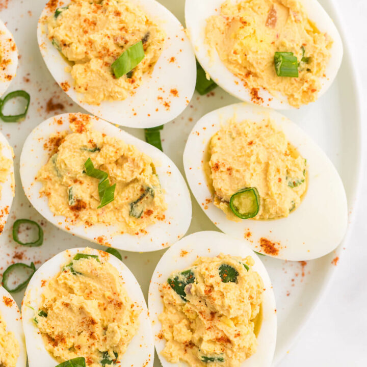 Salsa Deviled Eggs - a spicy kick to a popular appetizer recipe! This recipe is always gobbled up quickly.
