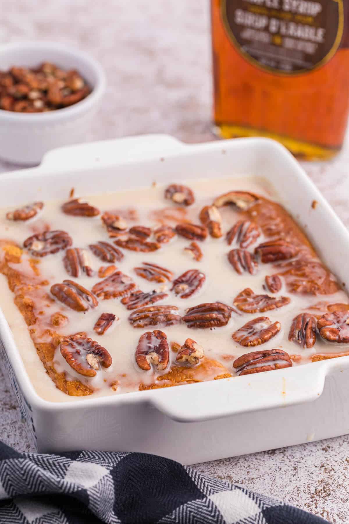 A maple pecan danish bake in a casserole dish.