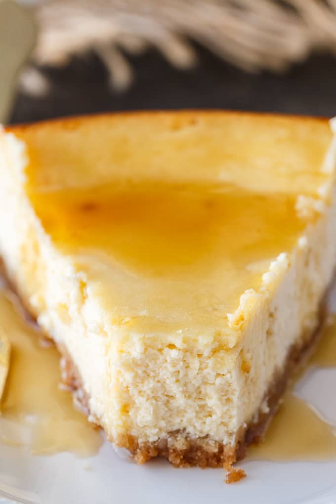 Maple Syrup Cheesecake - This might be the most Canadian cheesecake ever made! Using maple syrup to sweeten the cheesecake batter, and with maple syrup drizzled on top before serving, this smooth and creamy cheesecake is a great year round recipe - and perfect for a Canada Day celebration.