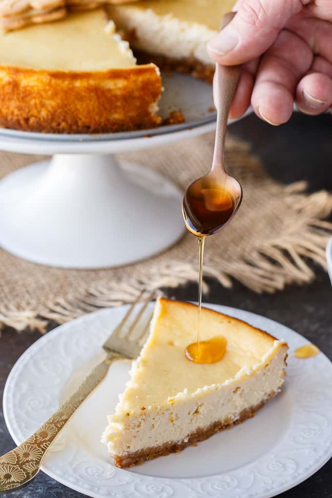 Maple Syrup Cheesecake - This might be the most Canadian cheesecake ever made! Using maple syrup to sweeten the cheesecake batter, and with maple syrup drizzled on top before serving, this smooth and creamy cheesecake is a great year round recipe - and perfect for a Canada Day celebration.