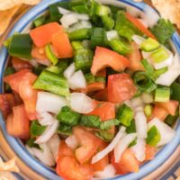 Pico de Gallo - The perfect Taco Tuesday topping! A super simple salsa recipe with tomatoes, peppers, onions, cilantro, and lime juice.