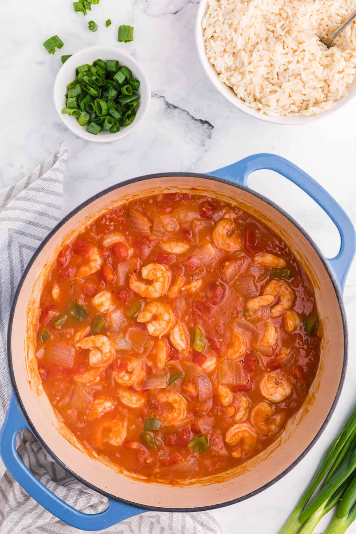 Shrimp creole in a blue dutch oven.