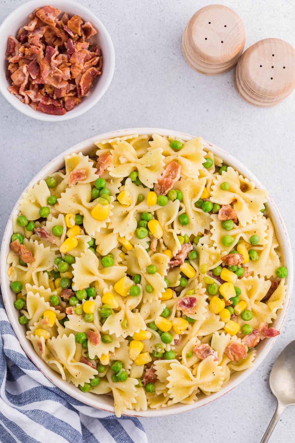 A bowl of bacon pea pasta salad.