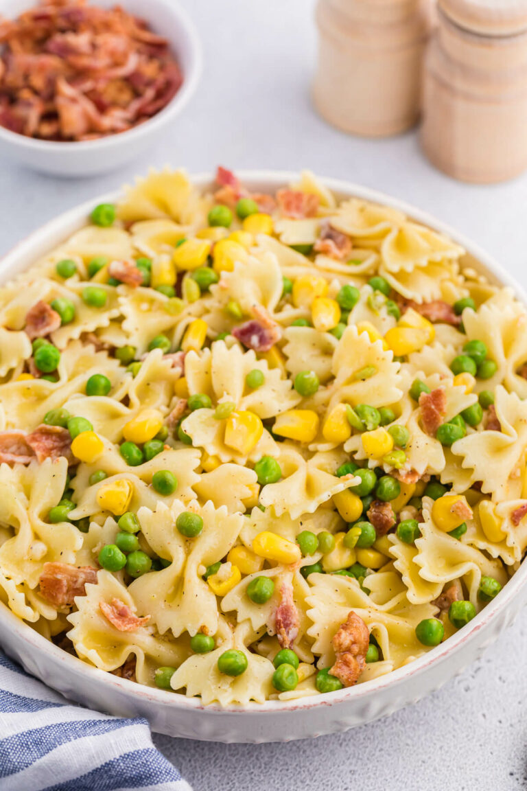 A bowl of bacon pea pasta salad.