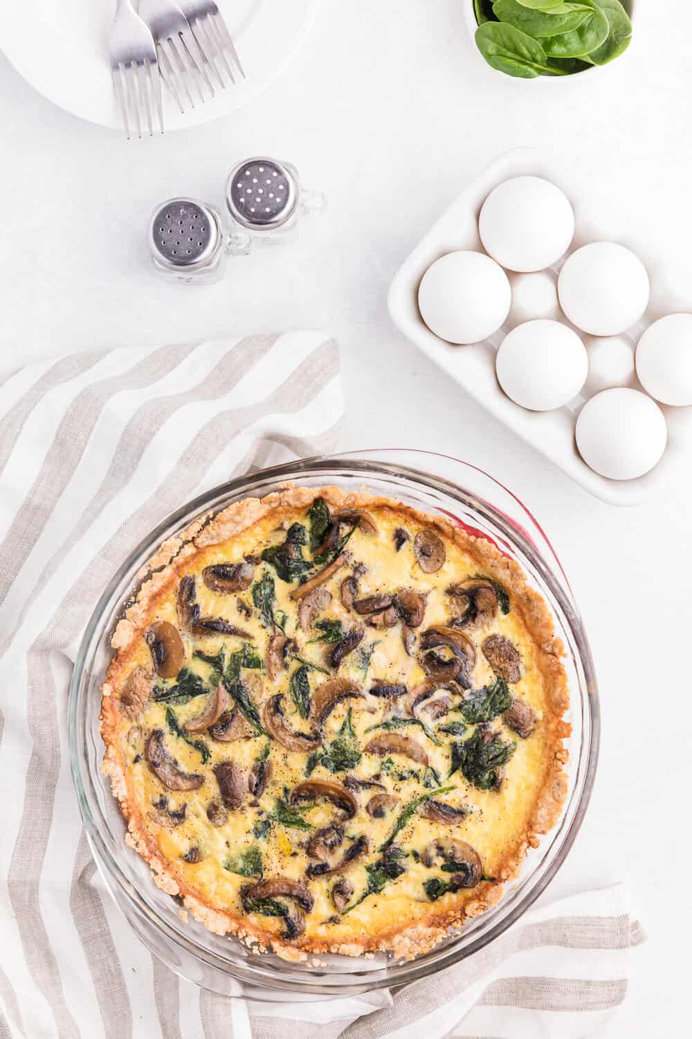 Spinach Mushroom Quiche- Fresh baby spinach, sliced mushrooms nestled in a creamy blend of eggs!