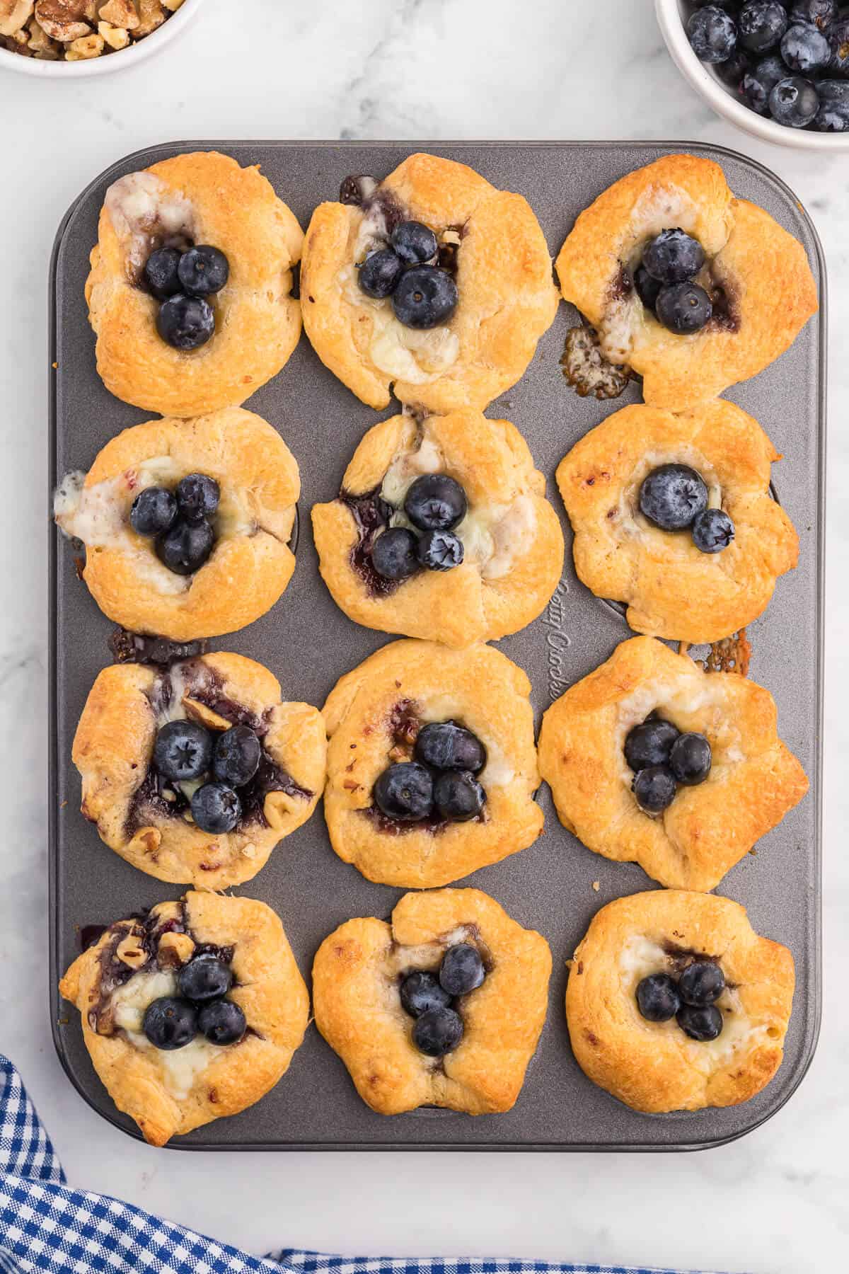 Blueberry Cheese Tarts - Sweet and savory combine in these delicate tarts! Serve as a sweet appetizer or a mini dessert.