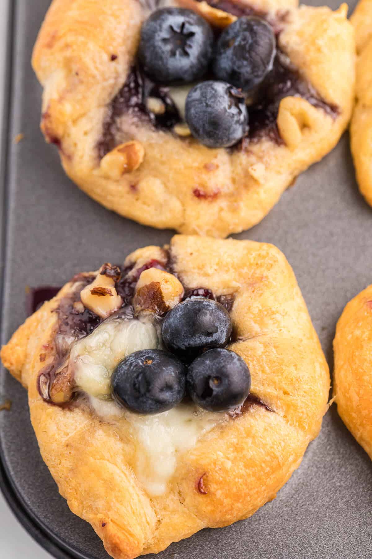 Blueberry Cheese Tarts - Sweet and savory combine in these delicate tarts! Serve as a sweet appetizer or a mini dessert.