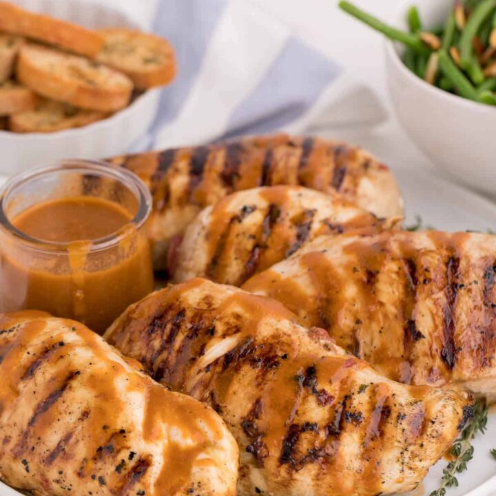 Grilled herb chicken on a plate.