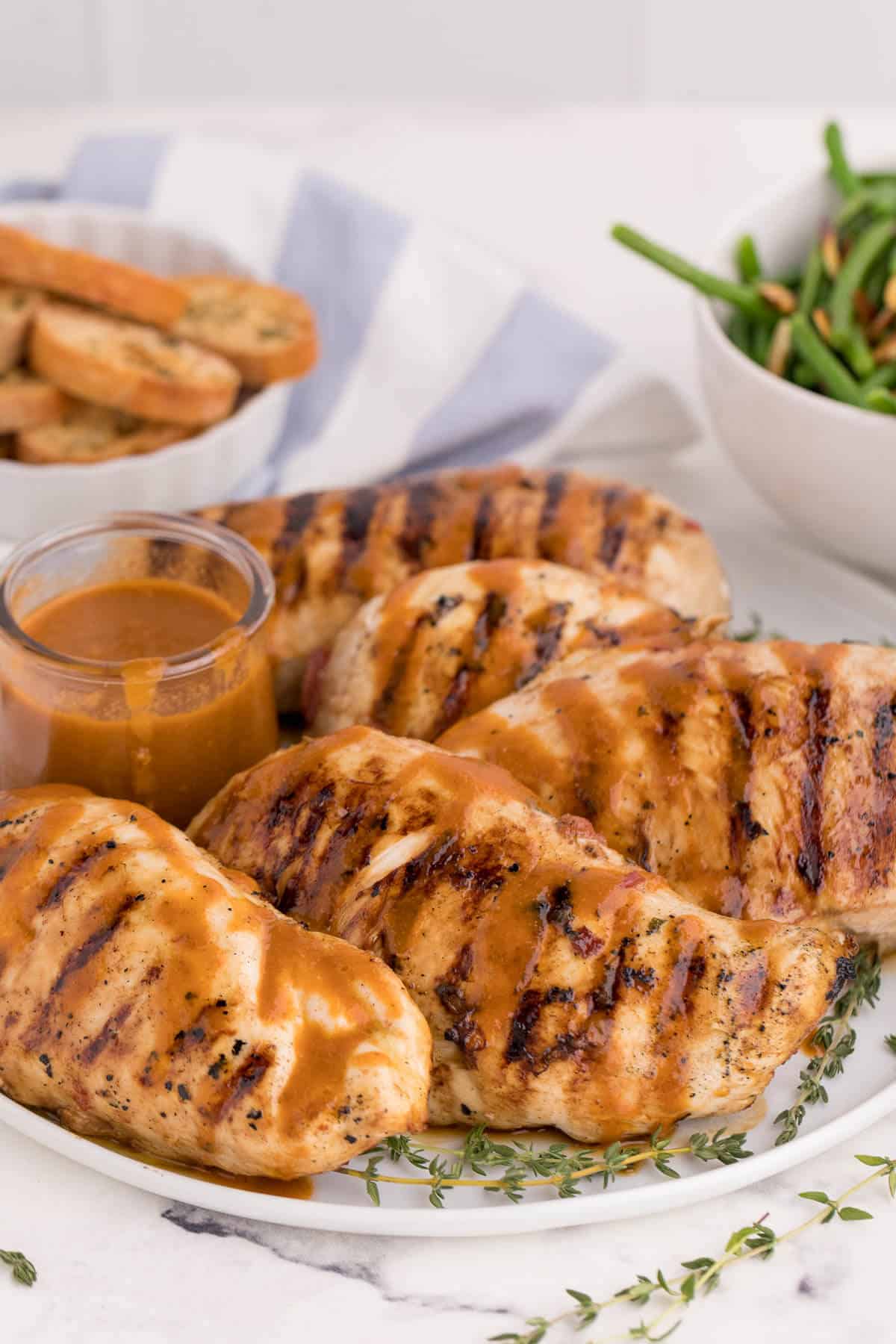 Grilled herb chicken on a plate.