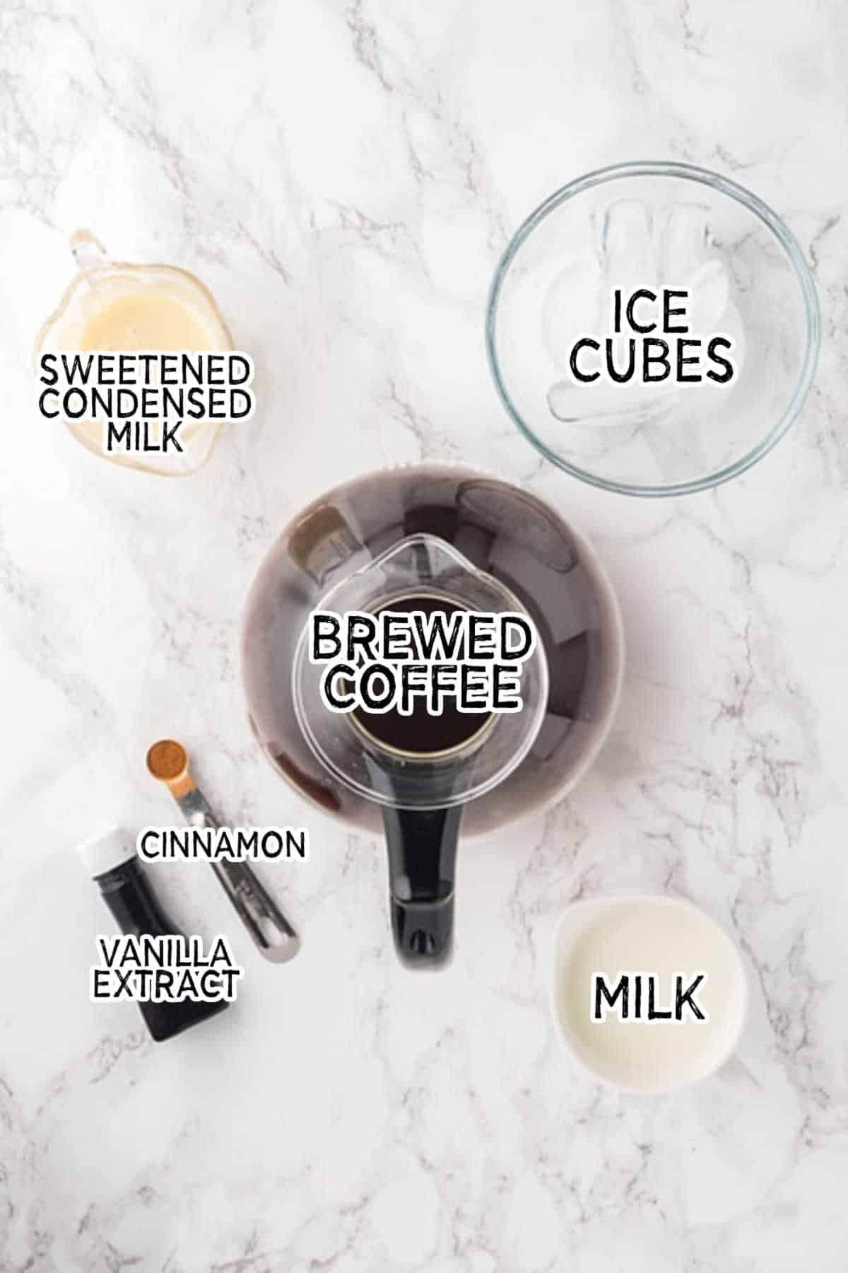 Ingredients to on a white marble counter.