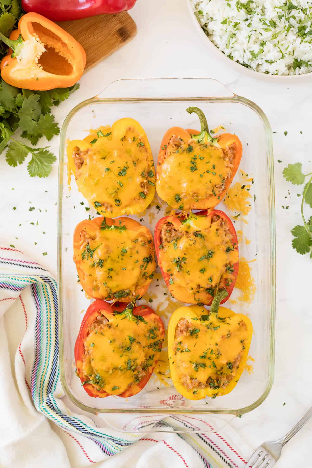 Mexican stuffed peppers in a casserole pan.