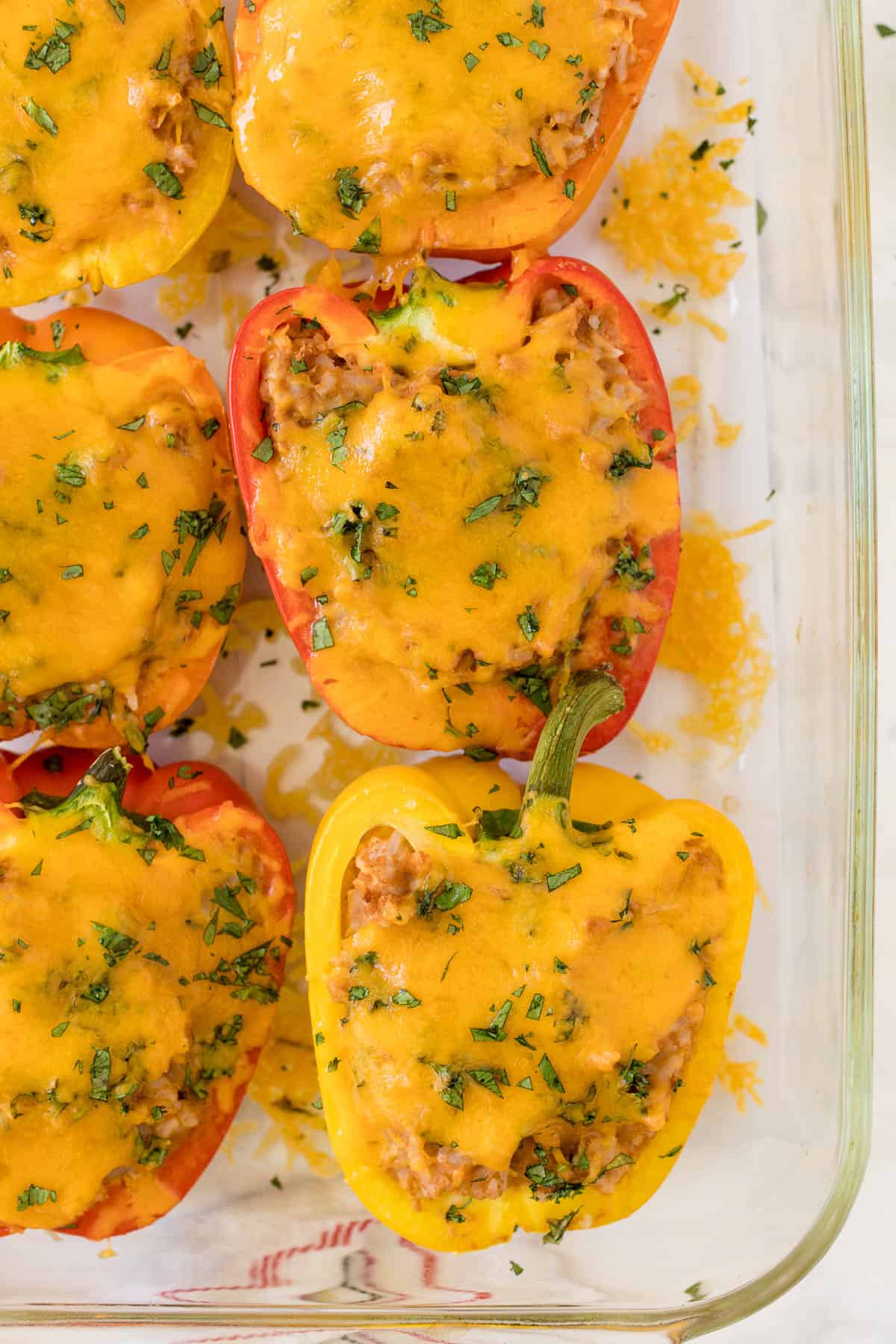 Mexican stuffed peppers in a casserole dish.