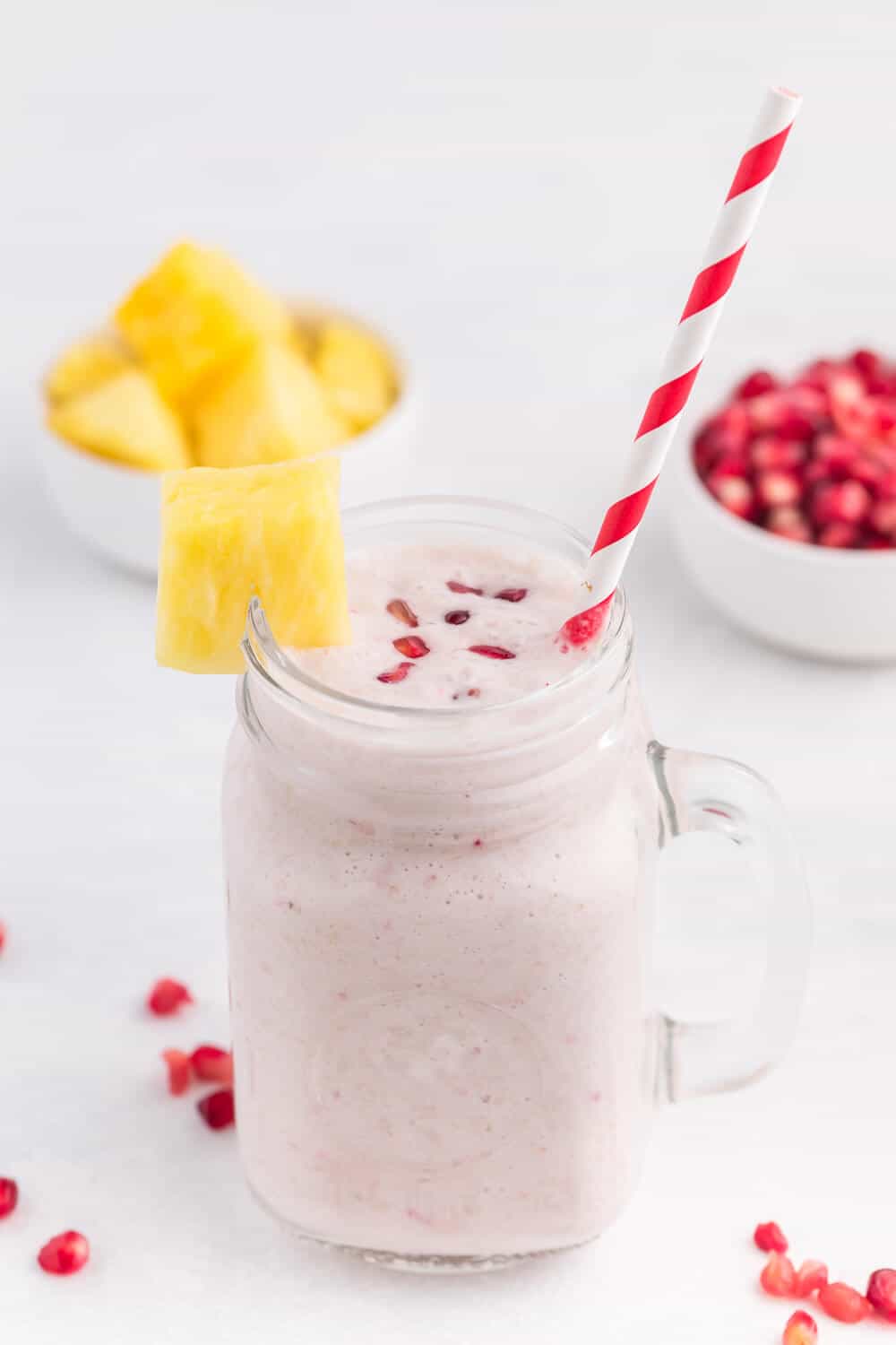 Pineapple Pomegranate Smoothie - Using a coconut milk base for a guilt-free tropical flavour, along with pineapple and banana, this smoothie will transport you to a tropical locale, without paying for a plane ticket!
