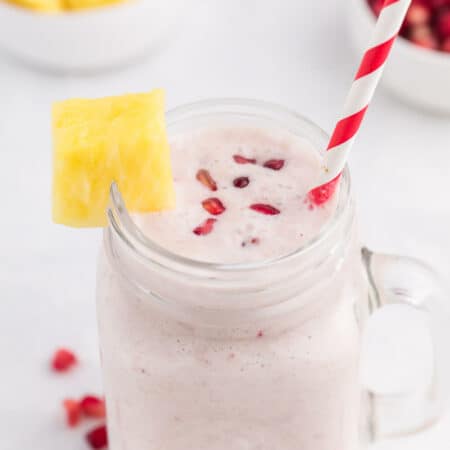 Pineapple Pomegranate Smoothie - Using a coconut milk base for a guilt-free tropical flavour, along with pineapple and banana, this smoothie will transport you to a tropical locale, without paying for a plane ticket!