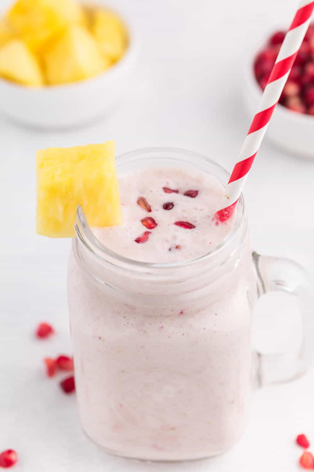 Pineapple Pomegranate Smoothie - Using a coconut milk base for a guilt-free tropical flavour, along with pineapple and banana, this smoothie will transport you to a tropical locale, without paying for a plane ticket!