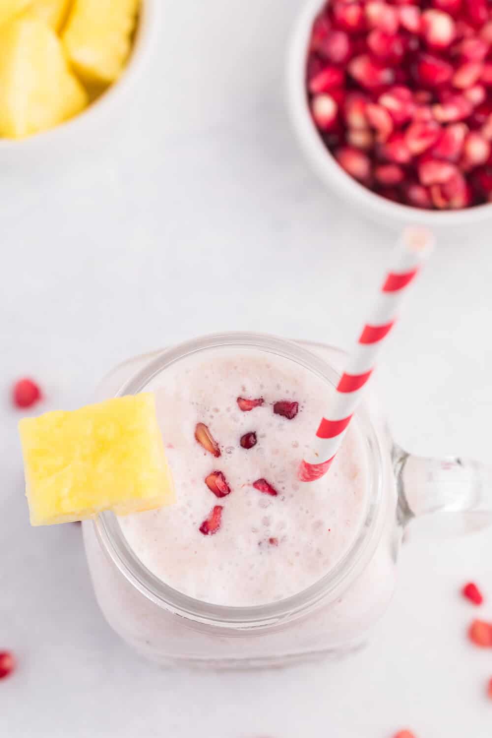 Pineapple Pomegranate Smoothie - Using a coconut milk base for a guilt-free tropical flavour, along with pineapple and banana, this smoothie will transport you to a tropical locale, without paying for a plane ticket!