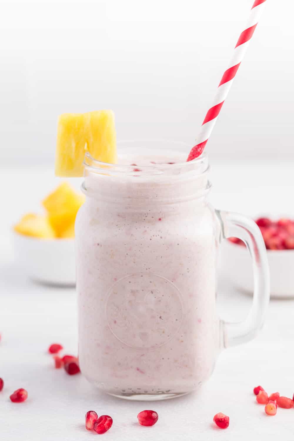 Pineapple Pomegranate Smoothie - Using a coconut milk base for a guilt-free tropical flavour, along with pineapple and banana, this smoothie will transport you to a tropical locale, without paying for a plane ticket!