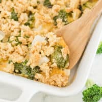 The recipe in a casserole dish with a wooden spoon.