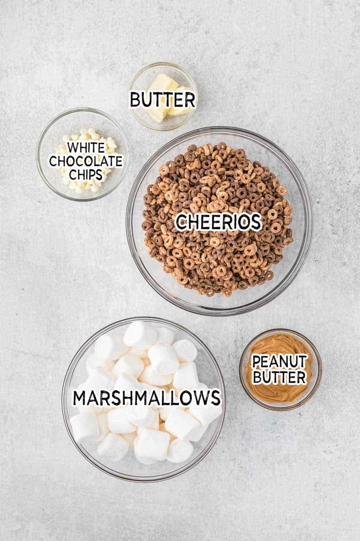 Ingredients to make white chocolate peanut butter cheerios treats.