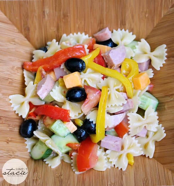 Roasted Pepper Pasta Salad - This pasta salad main dish is filled with ham, peppers, cucumbers, and topped with a mustard dressing. It's colorful, fresh and filling!