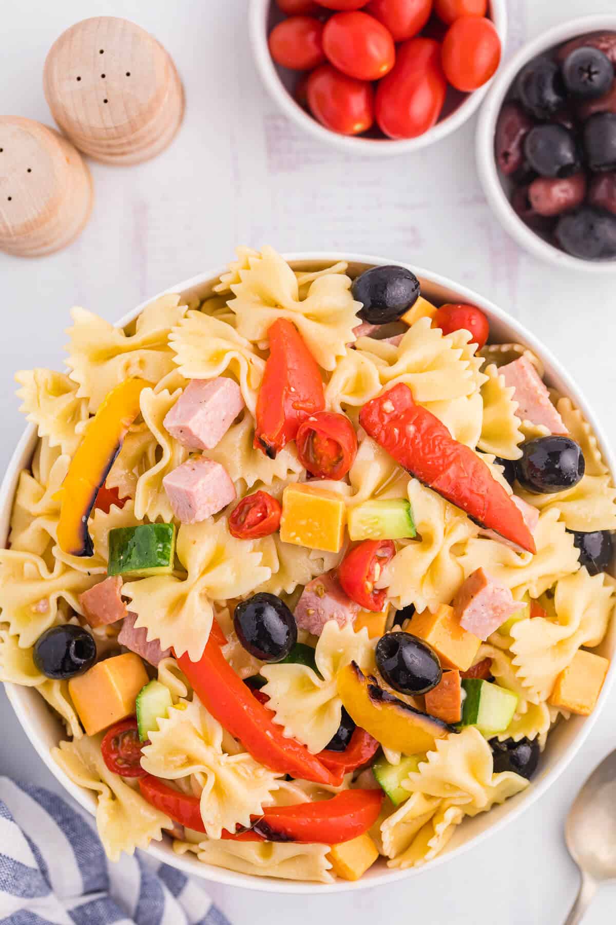 A bowl of roasted red pepper pasta salad.