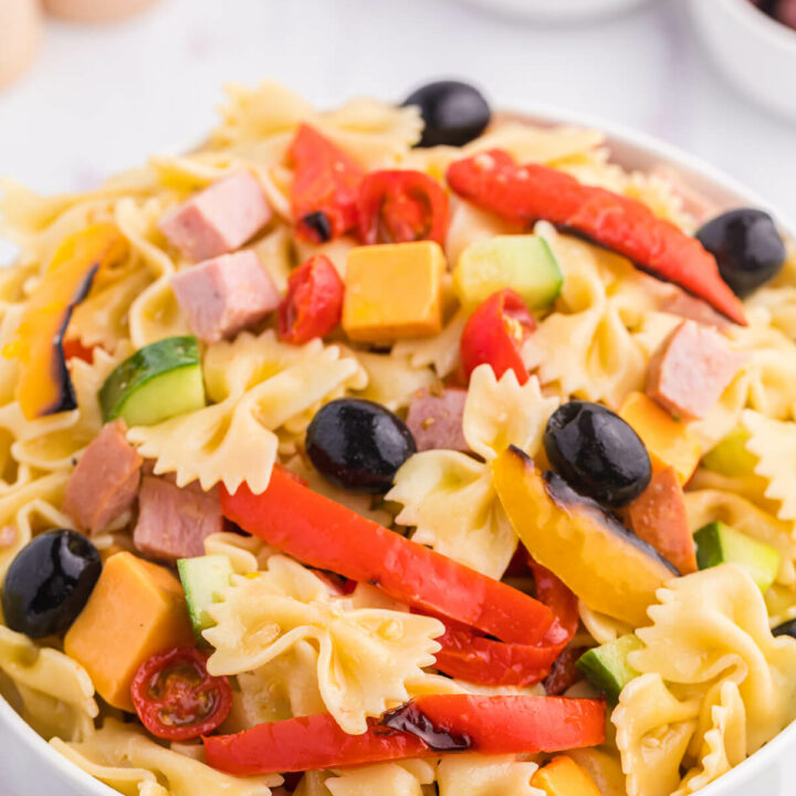 A bowl of roasted pepper pasta salad.